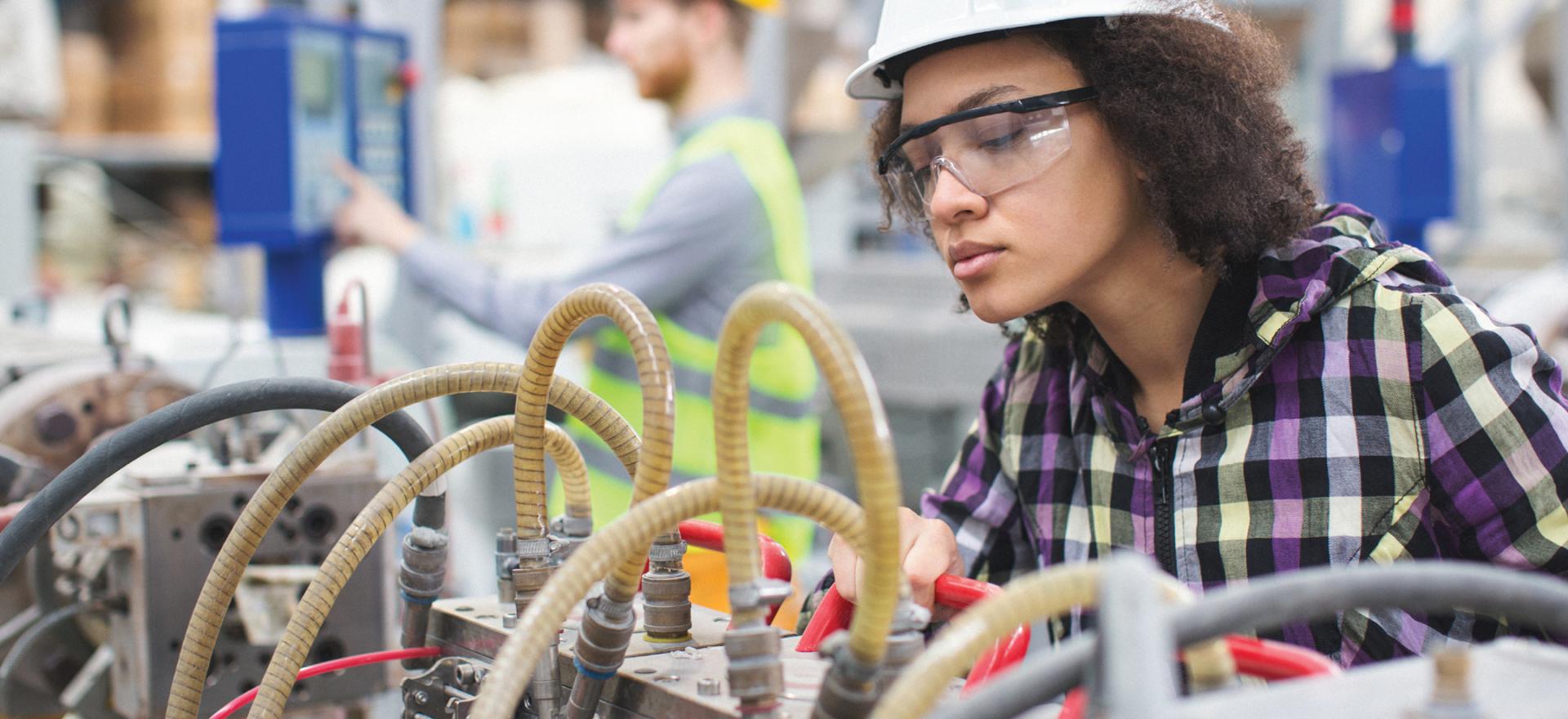 worker inspecting compressed air system