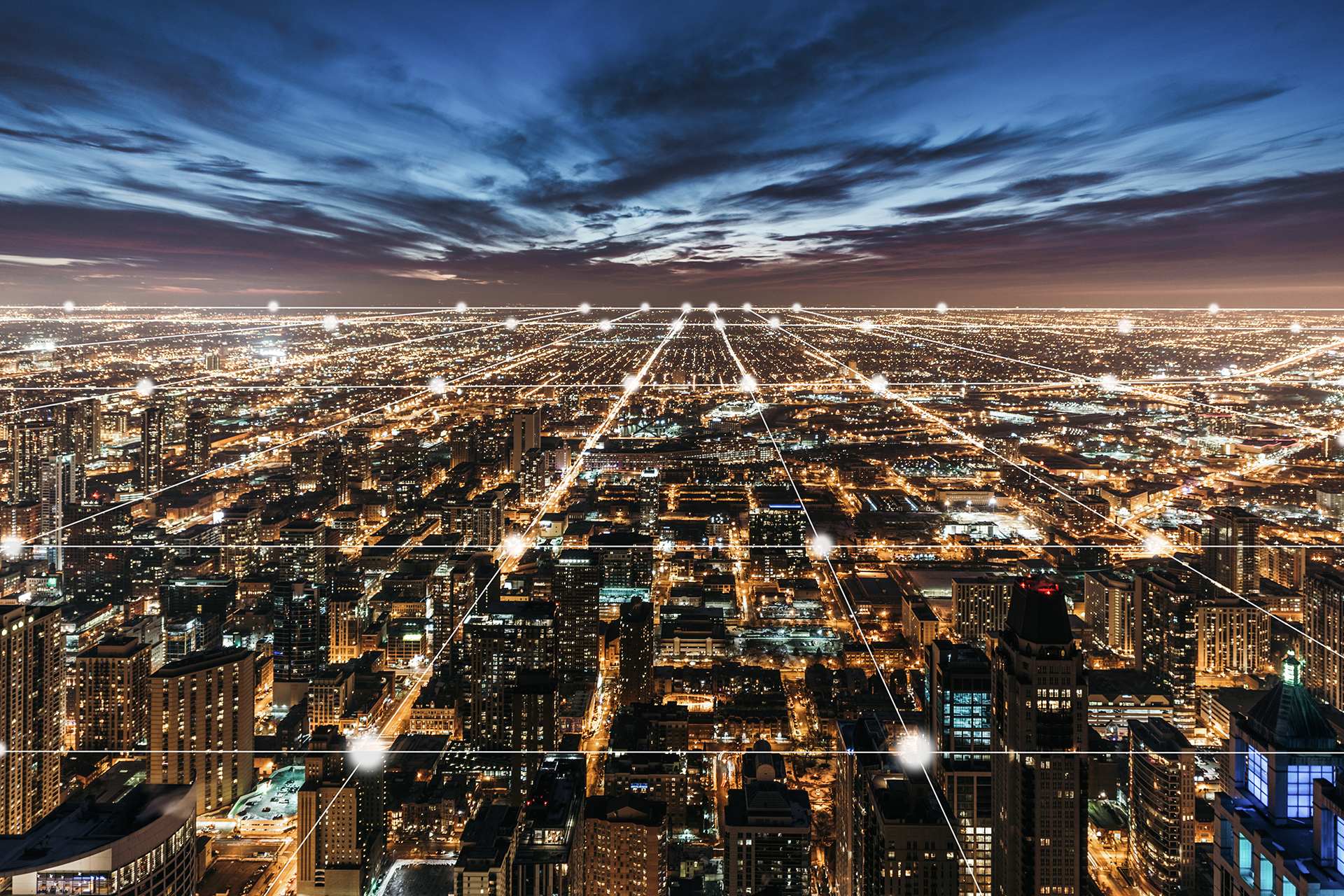 city at night symbolizing electric grid