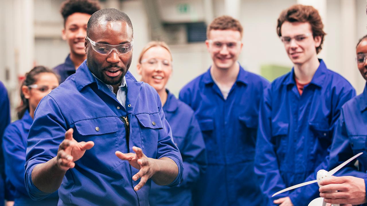 students collaborating in an industrial setting