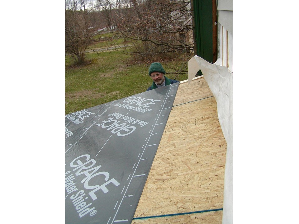 man looking at roof being constructed