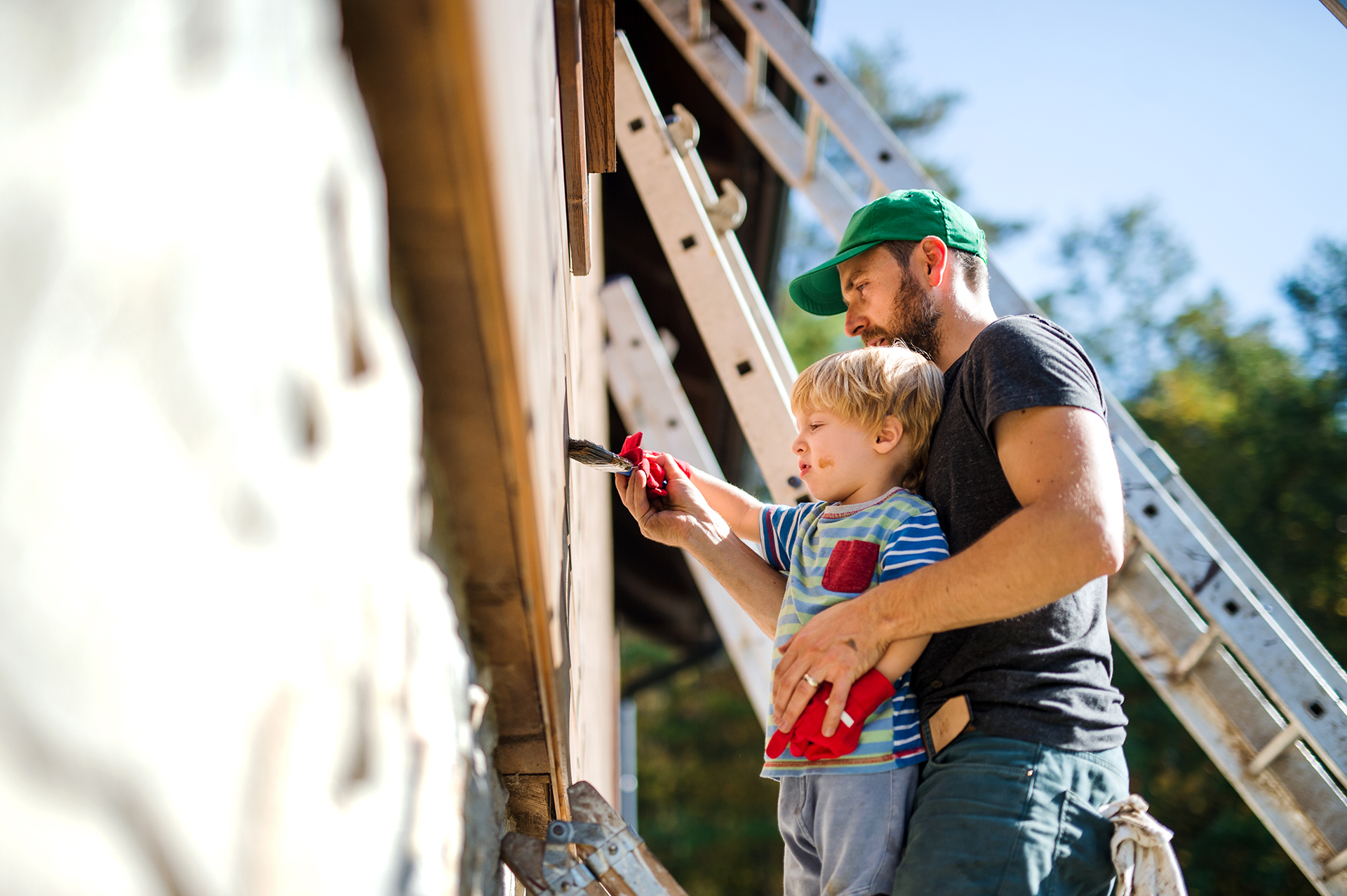 A father and child working on a home