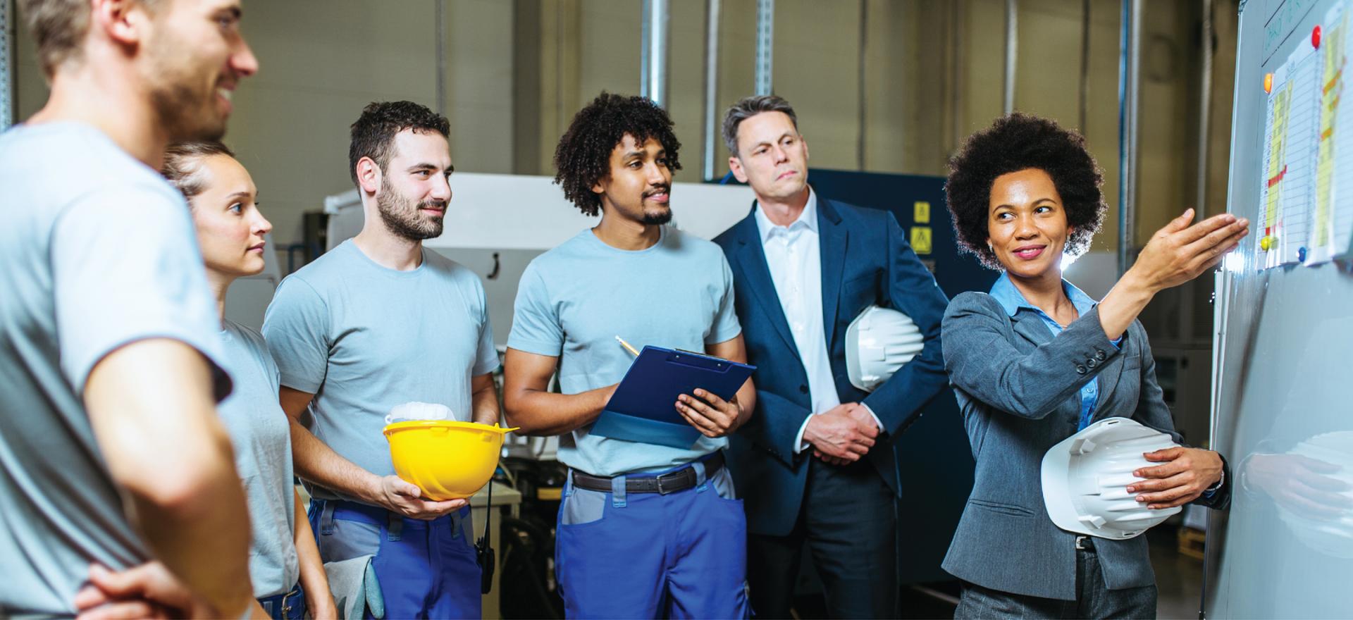 team with hard hats in a meeting