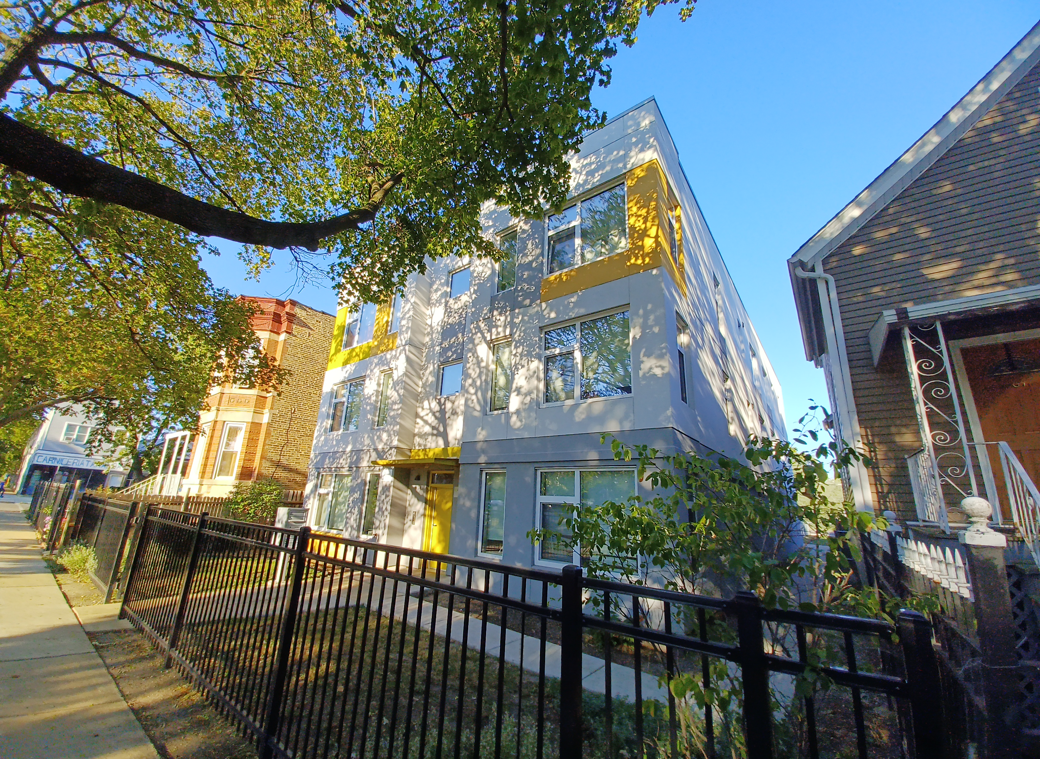 multifamily building in dappled shade