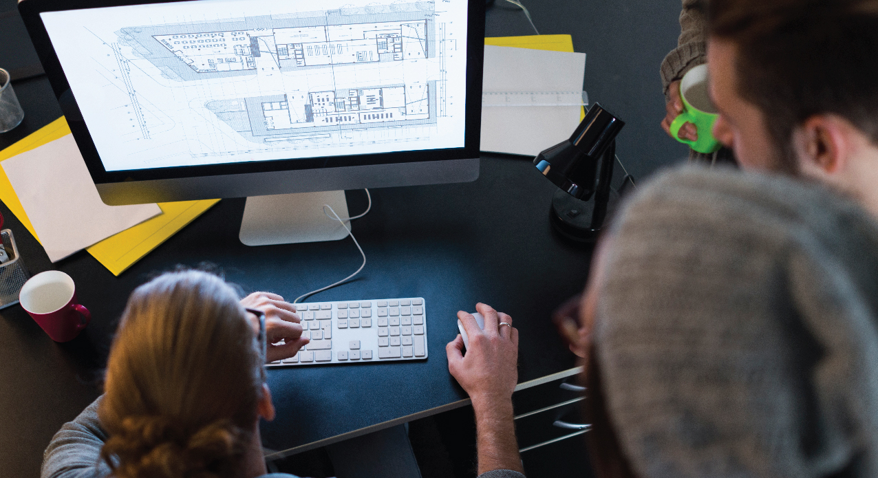 people collaborating around a computer