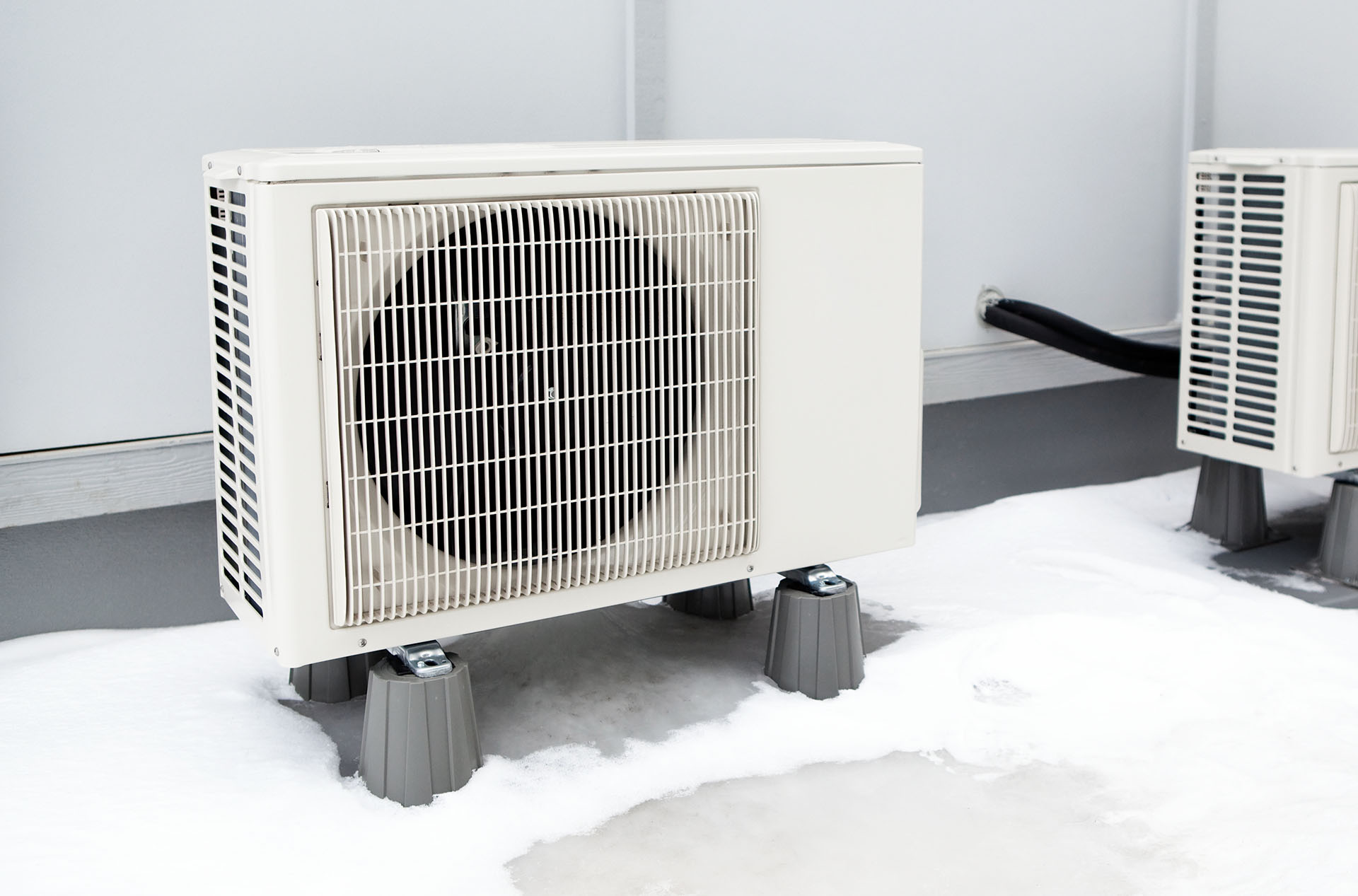 Heat pump unit in the winter, installed on risers