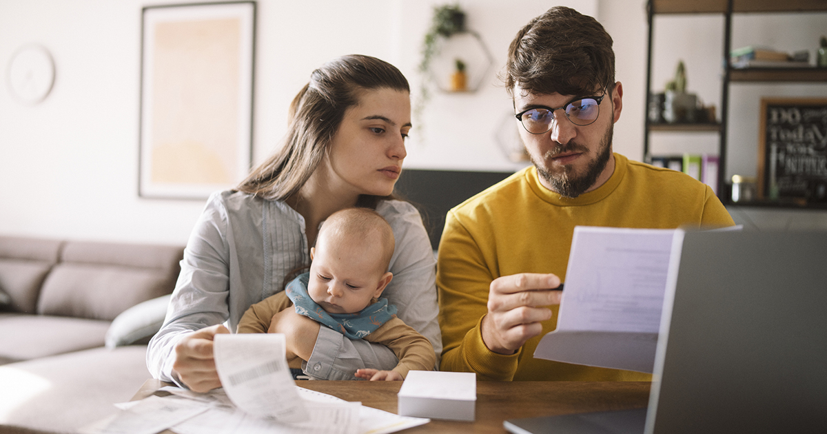 A young family looking at bills