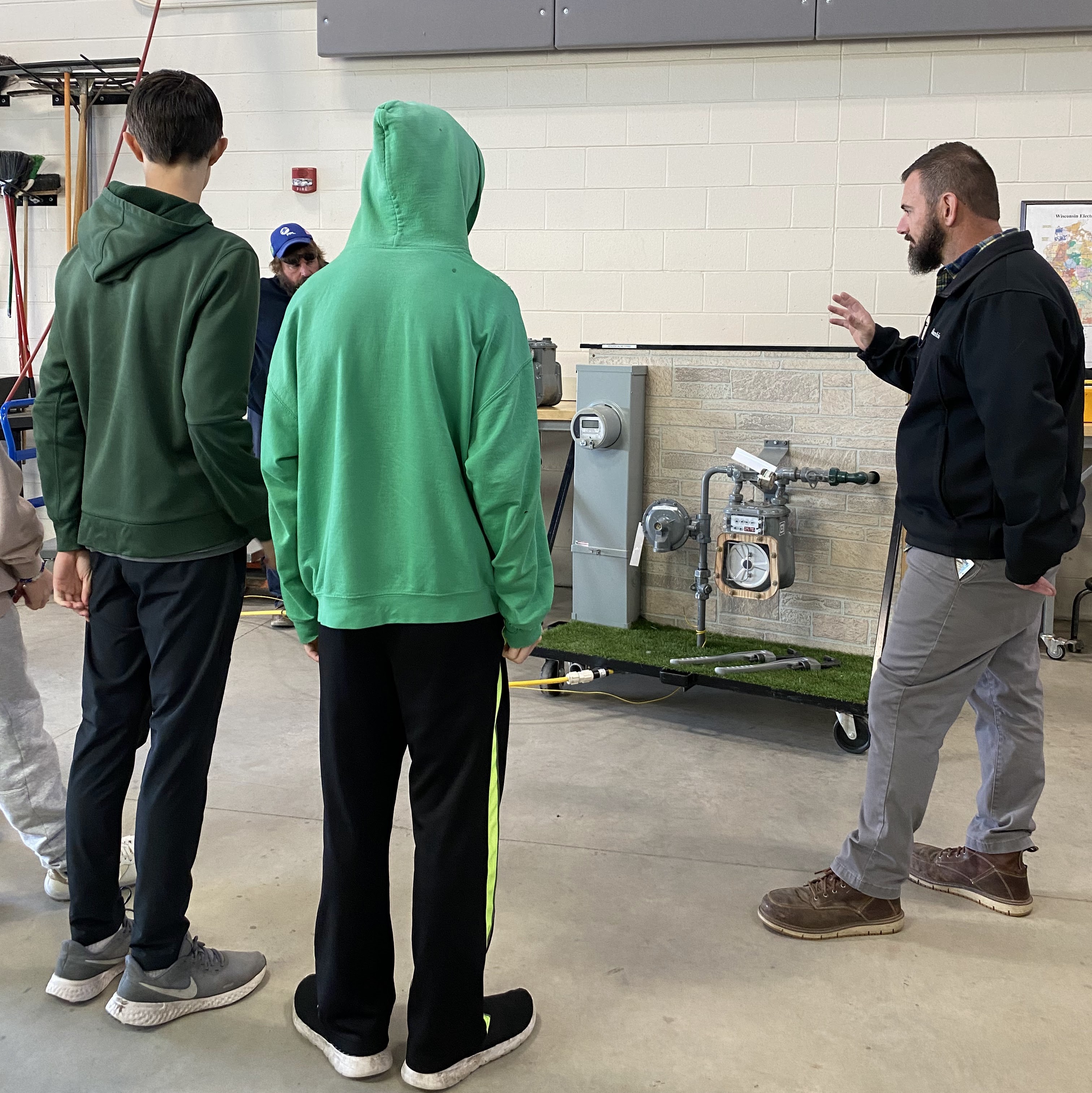 An instructor from Lennox gives a demonstration of HVAC components