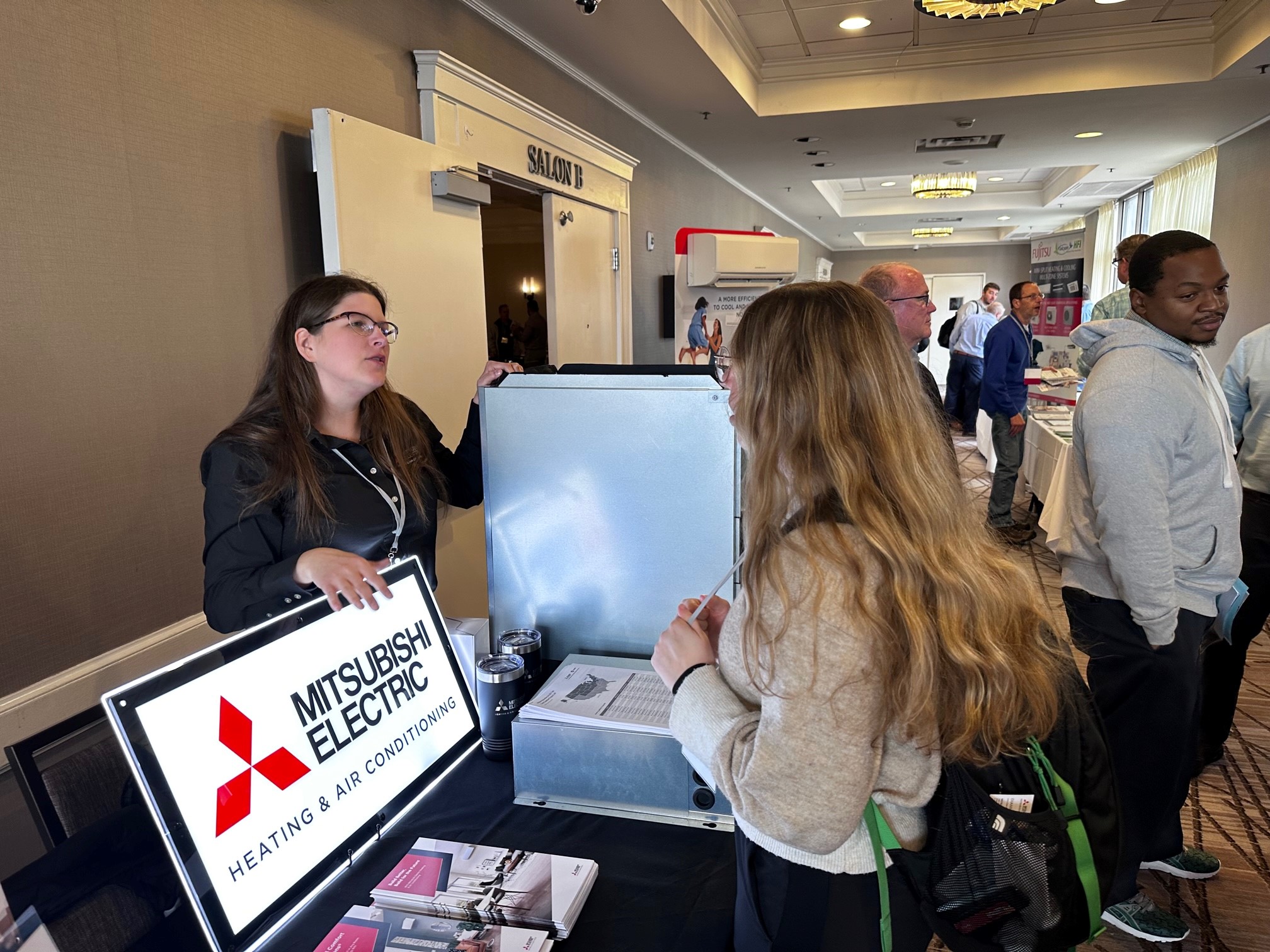 Dianna Cacko Corpolongo, an area sales manager at Mitsubishi, answers questions at one of the MIHPC's Contractor Summits, where contractors can interact directly with manufacturers and other market partners.